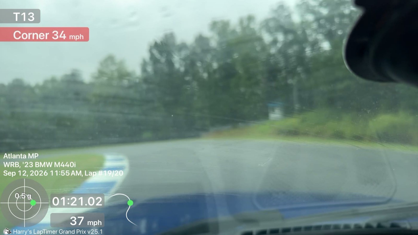 The M440i approaching the T13 apex in the rain, Saturday