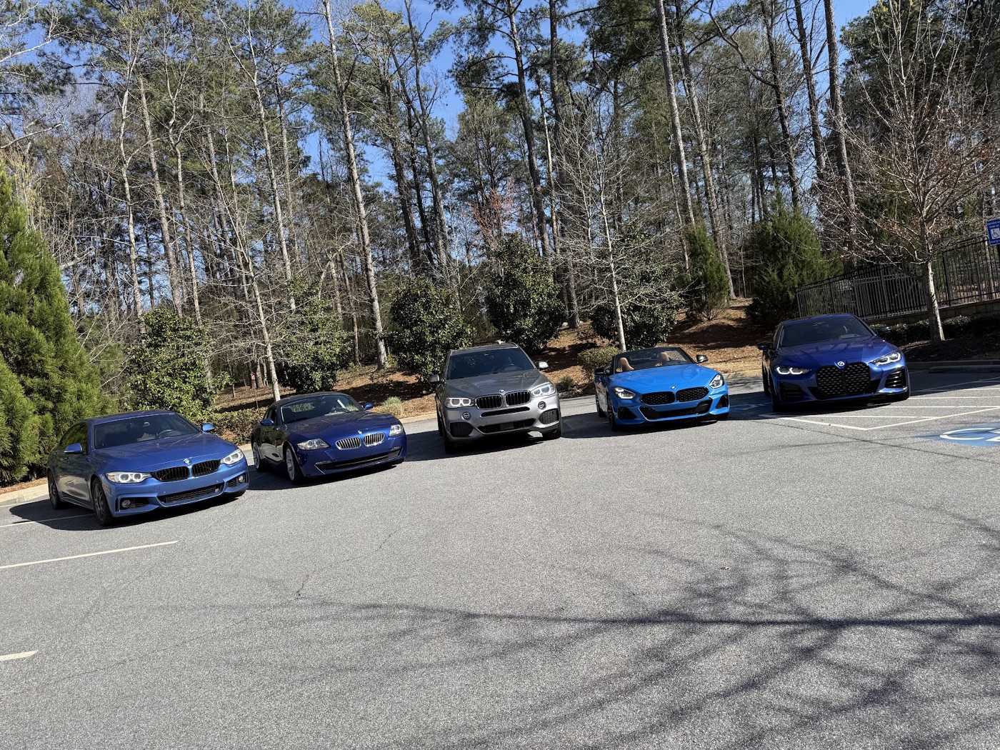 The whole garage: the 428i, the E86 Coupe, the X5, the G29 Roadster, the G26