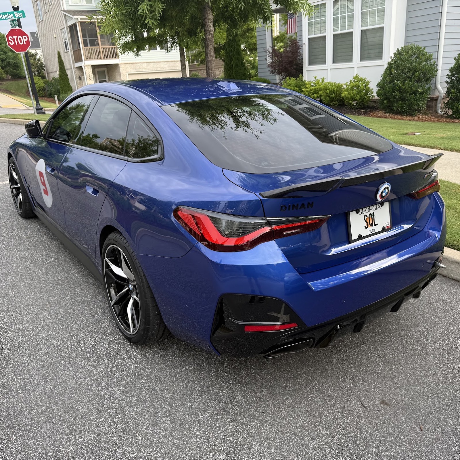 Blue BMW M440i with DINAN badging and a license plate that reads SQL