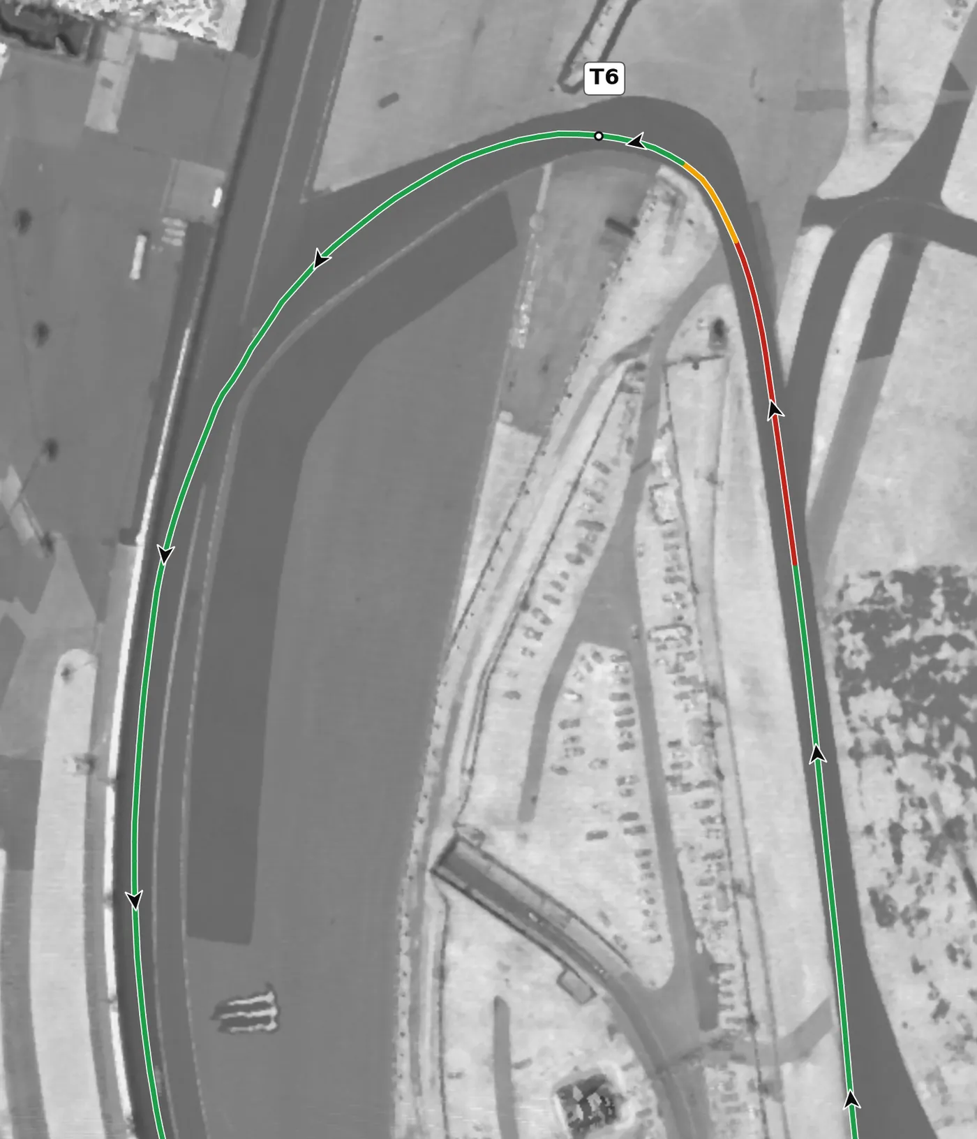 Daytona (road course) T6 race line close-up: 34 m of pavement at the apex; the exit starts to climb onto the banking.
