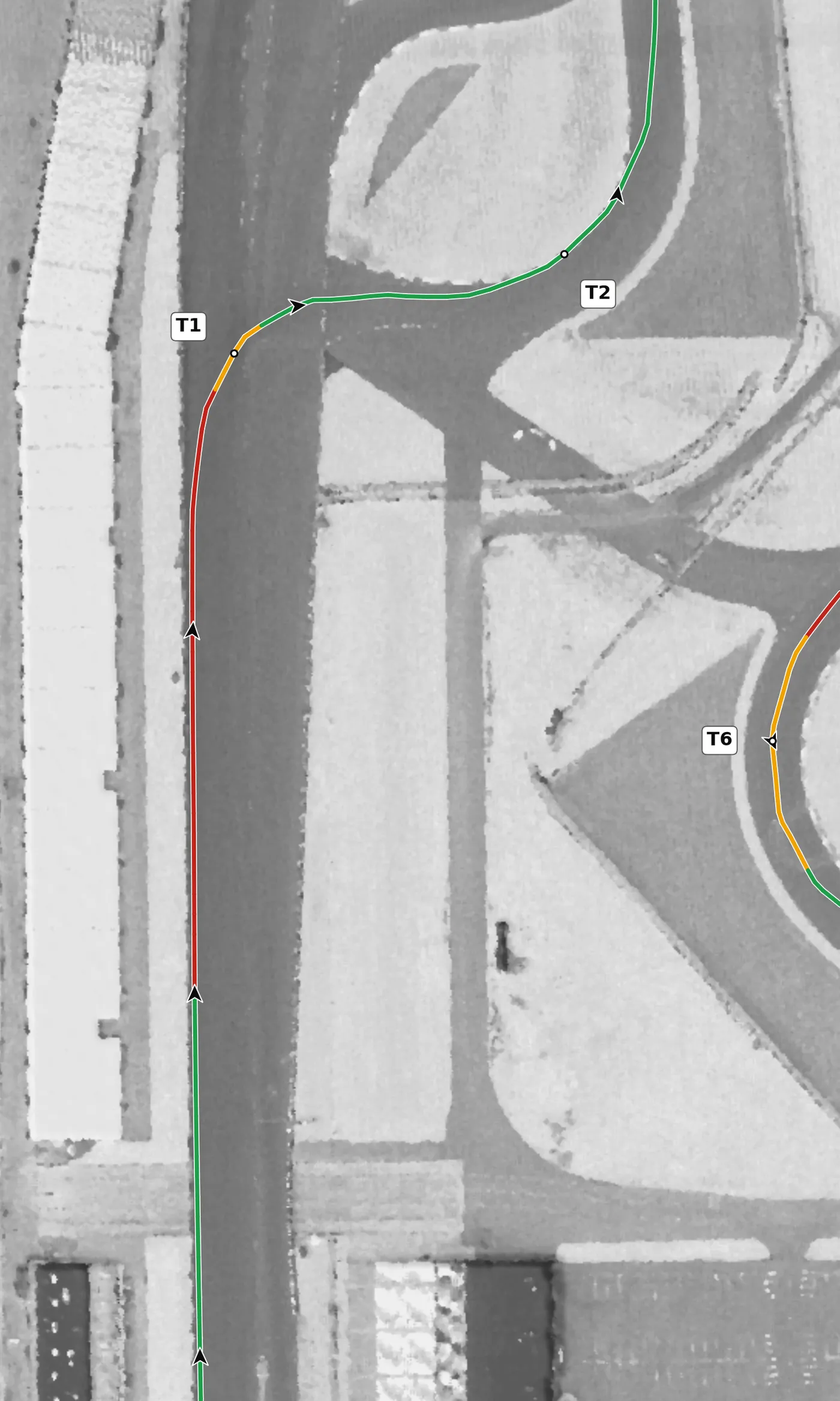 IMS road course T1 race line close-up: On camber at the apex (+4.7%), on the oval's pavement. The highest point on the lap is in its braking zone, and the exit falls at −3.9%, the steepest grade on the lap.