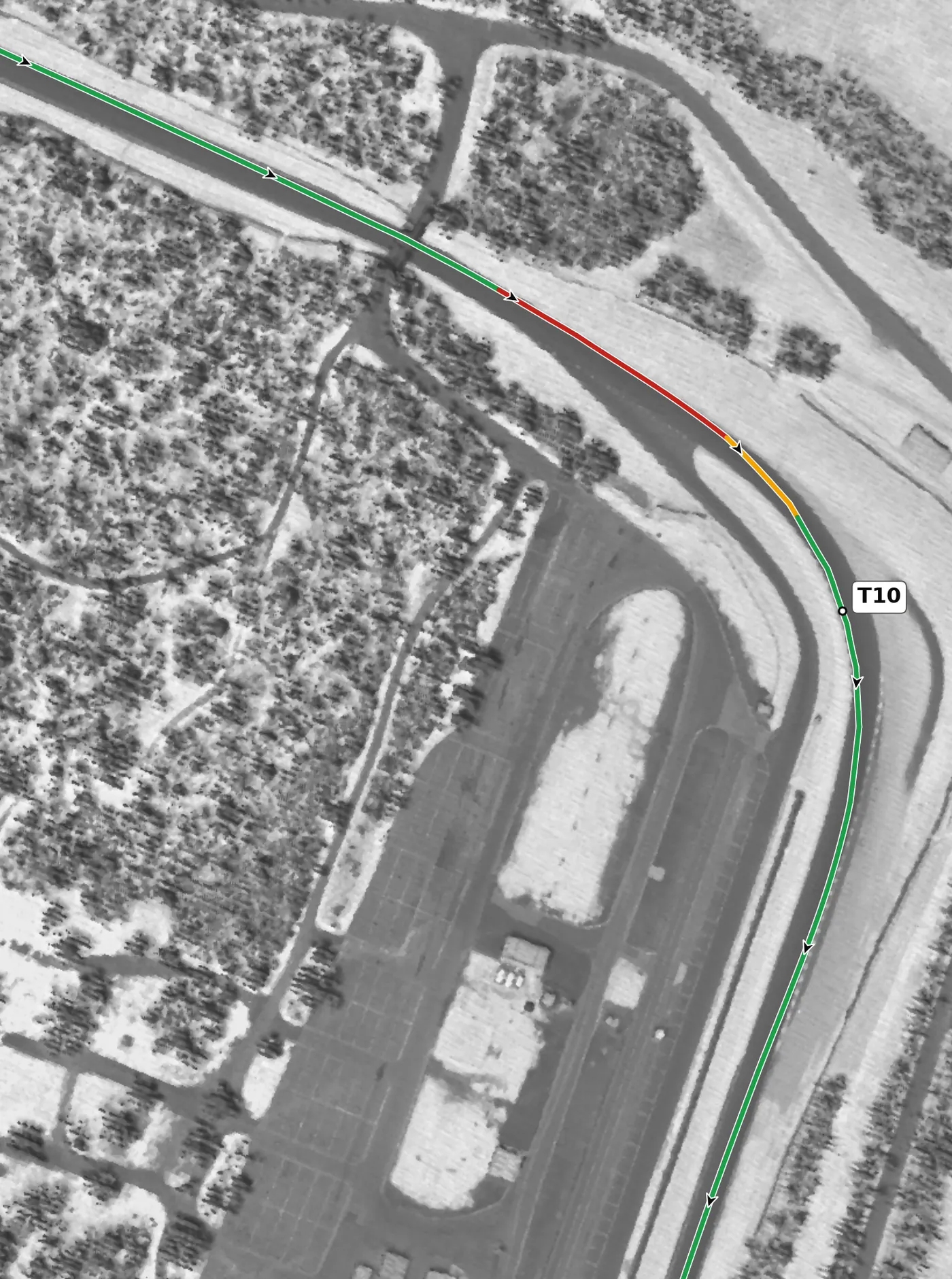 Summit Point T10 race line close-up: Banked +4.0%; the exit climbs at +1.9% to a crest on the front straight.