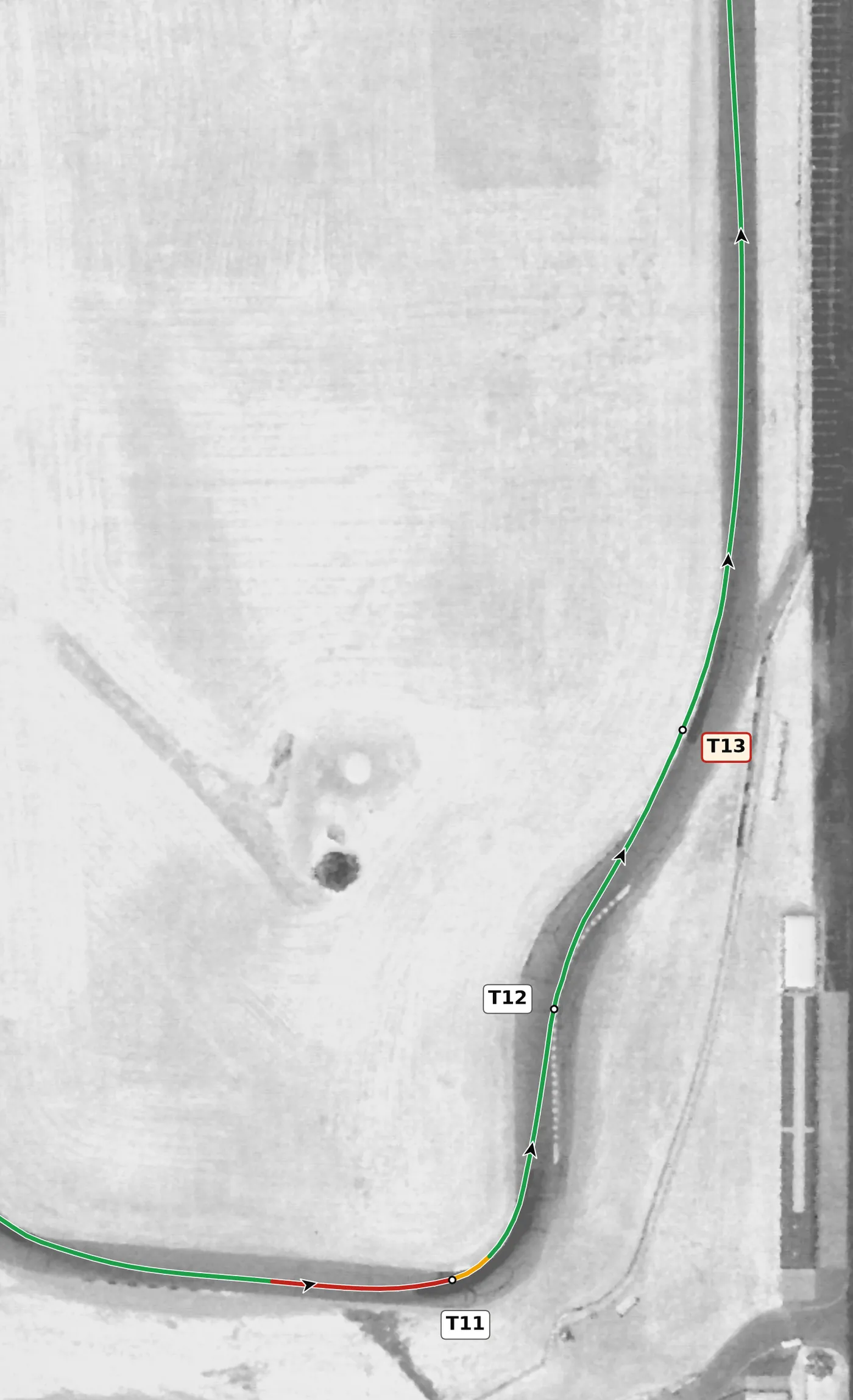 Thunderhill (East) T12–T13 race line close-up: T12 is banked (+3.0%); T13 is the only off-camber left on the lap (−2.9%).