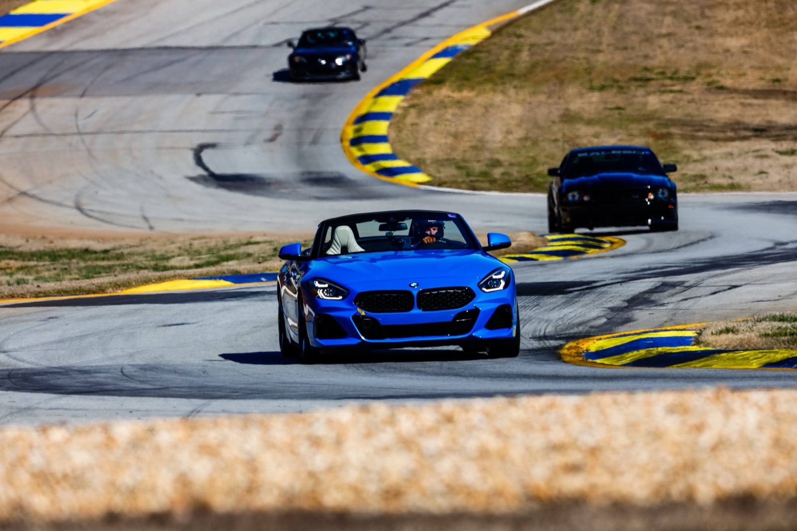 Blue BMW Z4 mid-corner at Road Atlanta